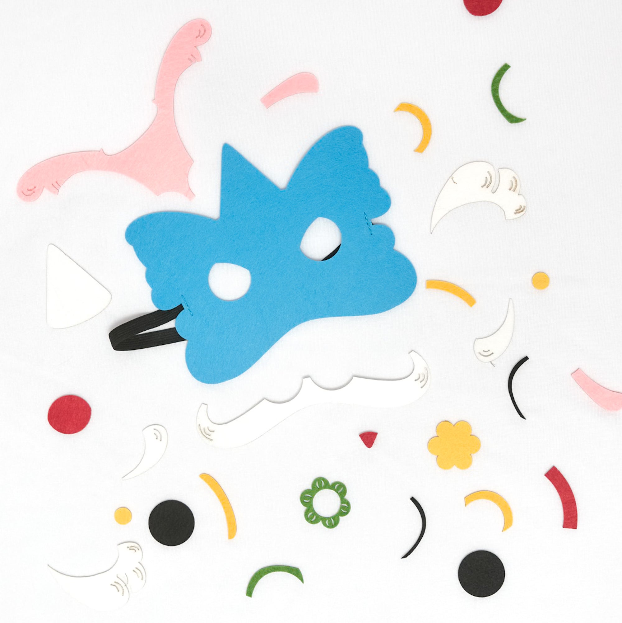 DIY craft kit featuring materials to make two felt lion dance masks, perfect for Lunar New Year celebrations and imaginative play.