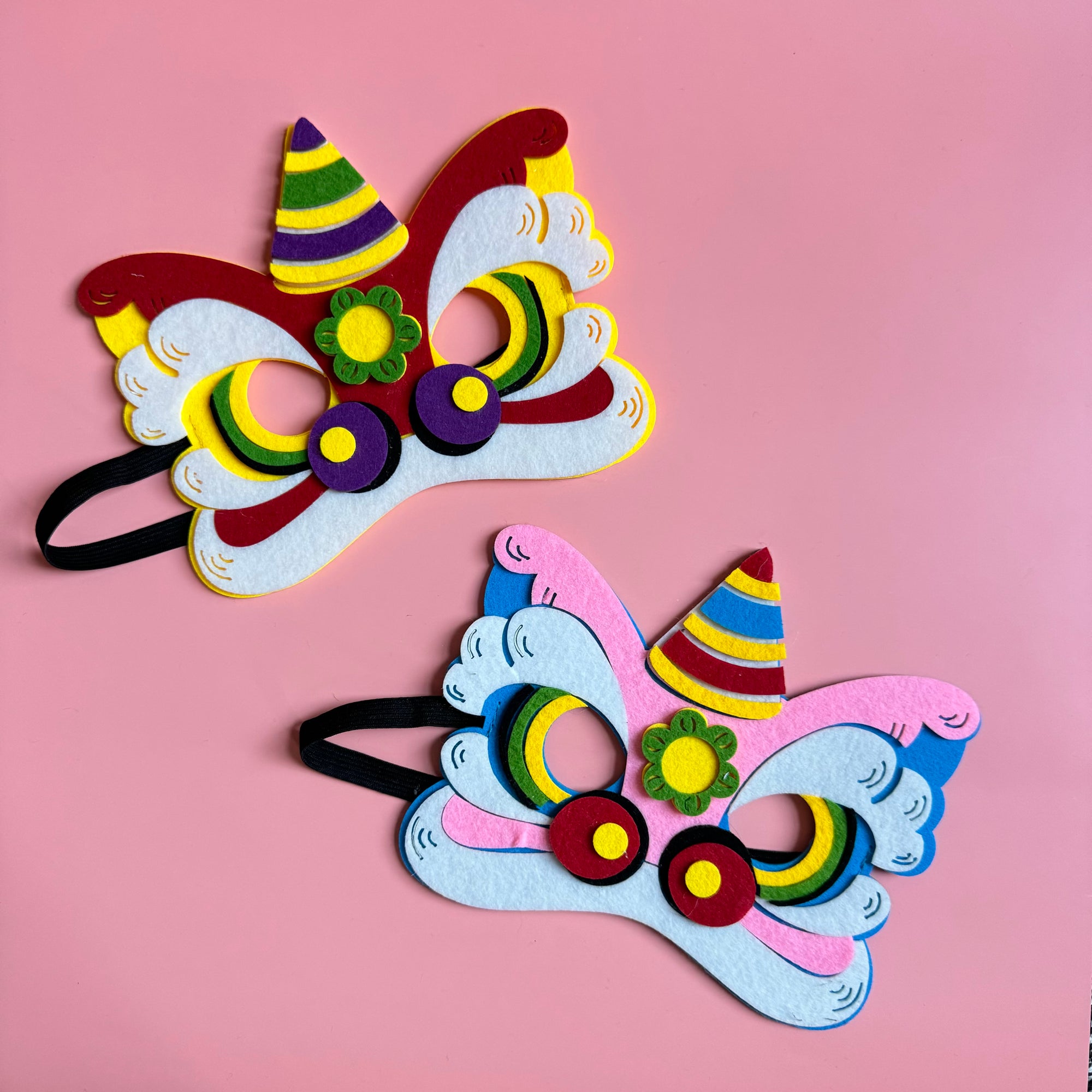 DIY craft kit featuring materials to make two felt lion dance masks, perfect for Lunar New Year celebrations and imaginative play.