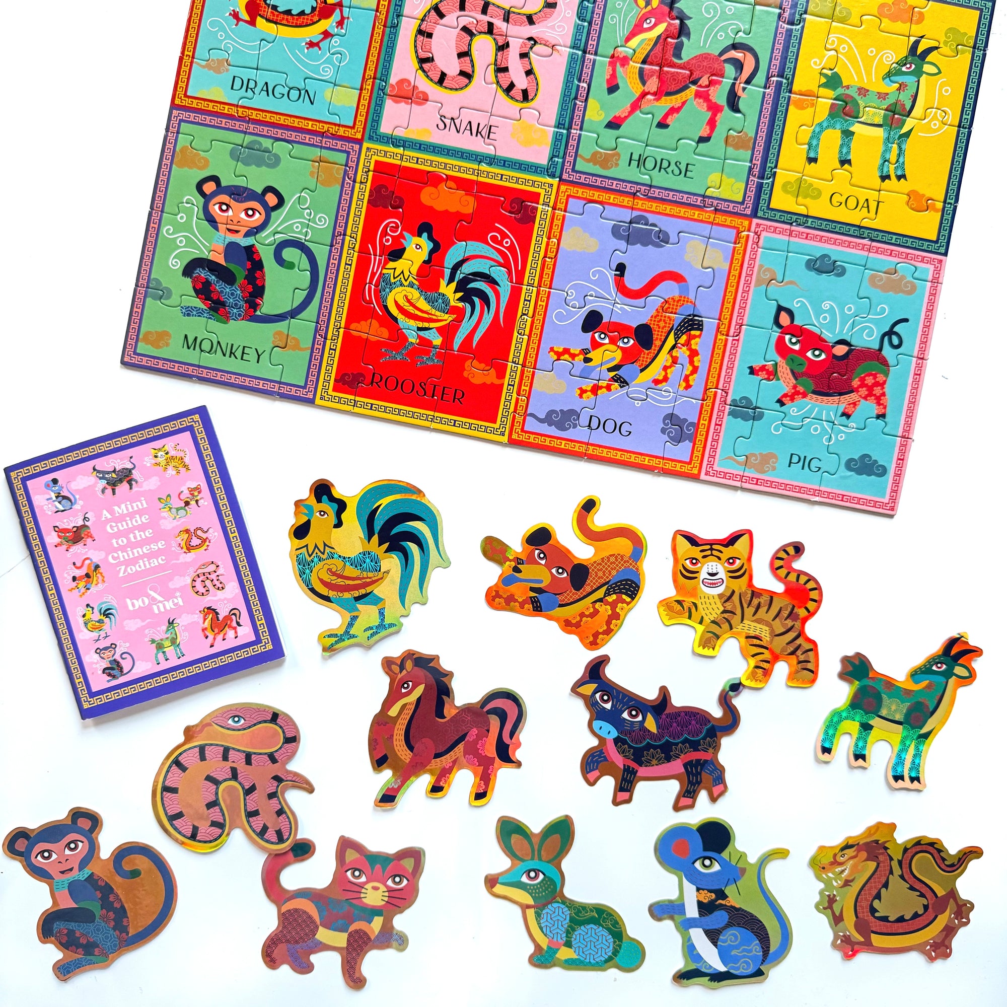 Colorful 100-piece square puzzle featuring the 12 Chinese and Vietnamese Zodiac animals in intricate designs, ideal for cultural learning and family fun for Lunar New Year Chinese New Year Tet. Includes colorful sticker set of Zodiac animals and and mini guidebook to the Chinese Zodiac.