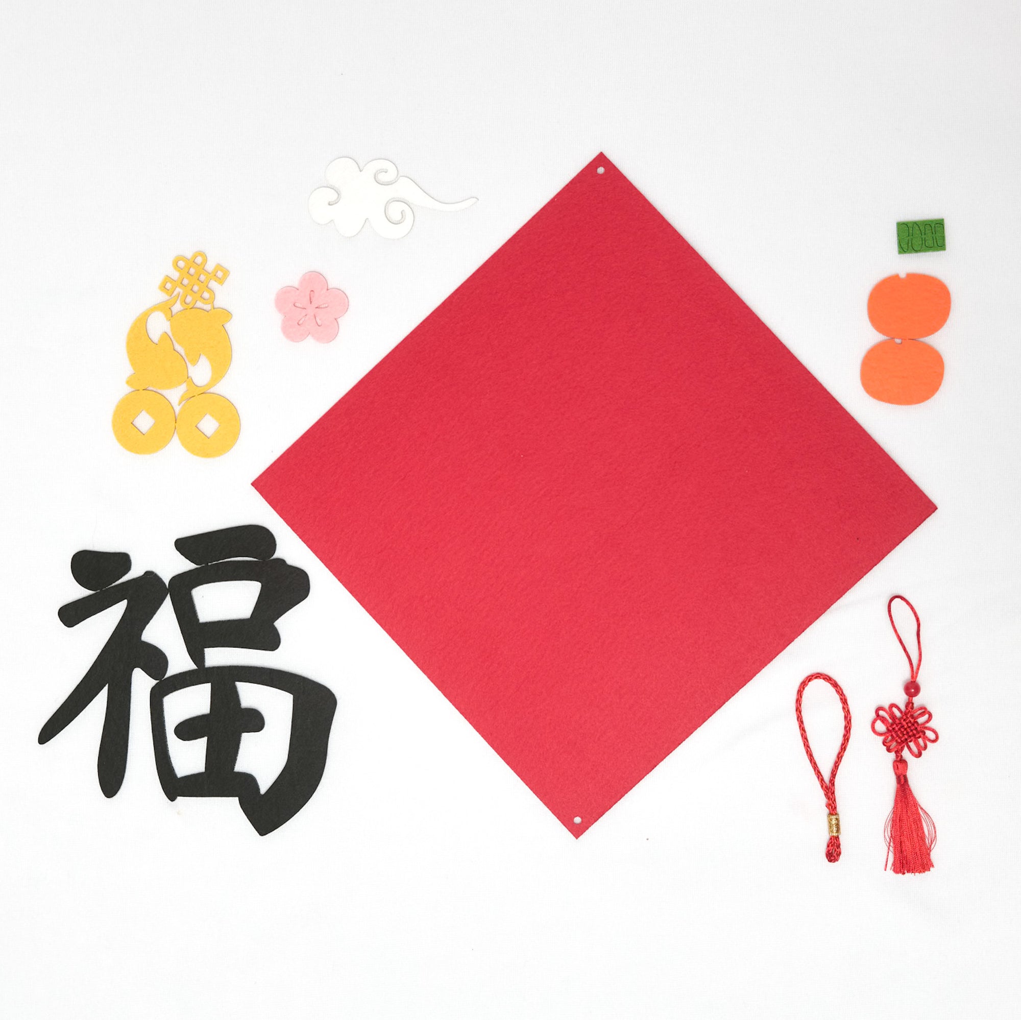 Craft kit with felt cut-outs for creating Chinese “fu,” Vietnamese “Tết,” and “Happy Lunar New Year” hangings, complete with tassels and adhesive.