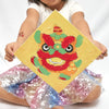 Paint-by-number kit featuring Lunar New Year symbols—fish, oranges, and a lion dance—with canvases, paints, and brushes for creative fun.