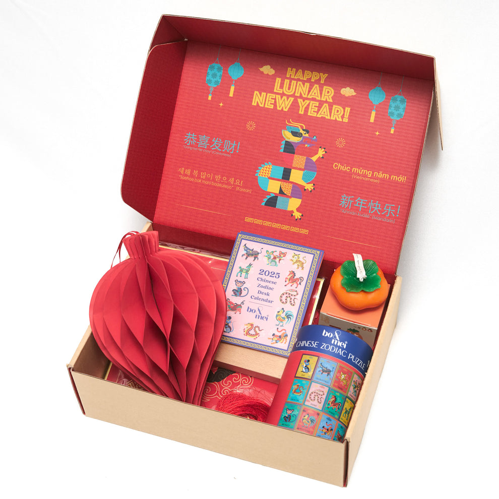 An open box with a variety of Lunar New Year gifts inside